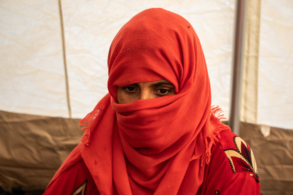 Rabieh Jamali inside one of the MSF tents at the Herat Regional Hospital where she is receiving treatment after sustaining injuries to the head and leg after the first earthquake. Afghanistan, 2023. © Paul Odongo/MSF
