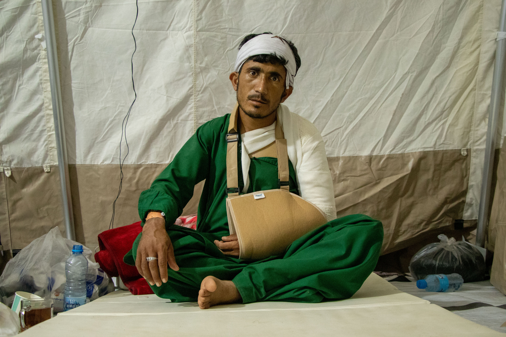 Sangin from Noebe Fil Village in Zindah Jan District. He is receiving treatment for a broken arm and sprained shoulder. Four of his sisters died in the earthquake. Afghanistan, 2023. © Paul Odongo/MSF