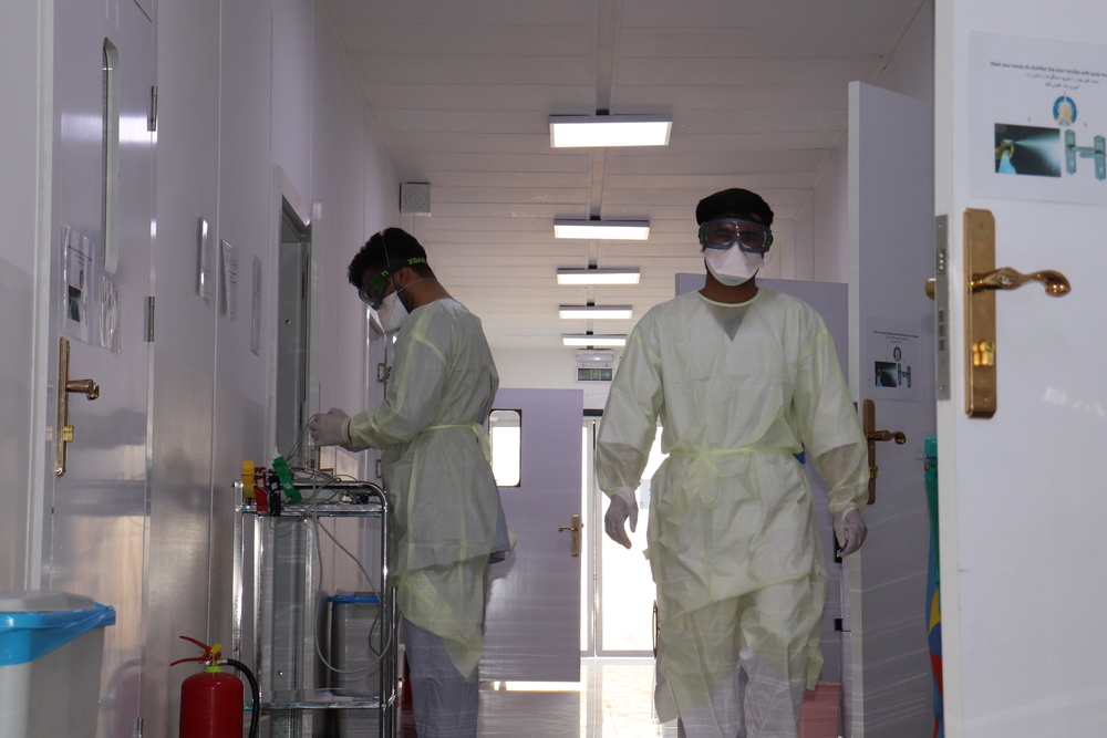  Farhad “Farahmand”, nurse assistant and Noor Ahmad “Nasrat”, health promoter, pictured in the male ward of MSF’s COVID-19 Treatment Centre, Gazer Ga, Heart