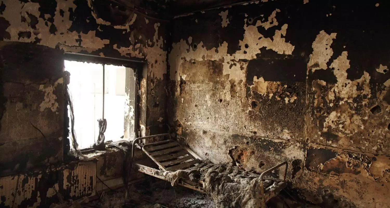 The remains of a bed frame in a room on eastern wing of the main Outpatient Department building of Kunduz hospital. Afghanistan, 2015.