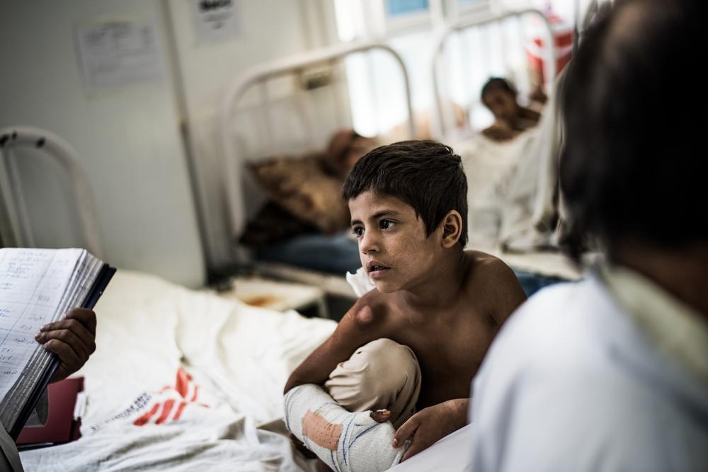 A child sits in the orthopaedic ward of Boost hospital which is run by MSF in partnership with the Ministry of Public Health in Lashkar gah, helmand, Afghanistan.
