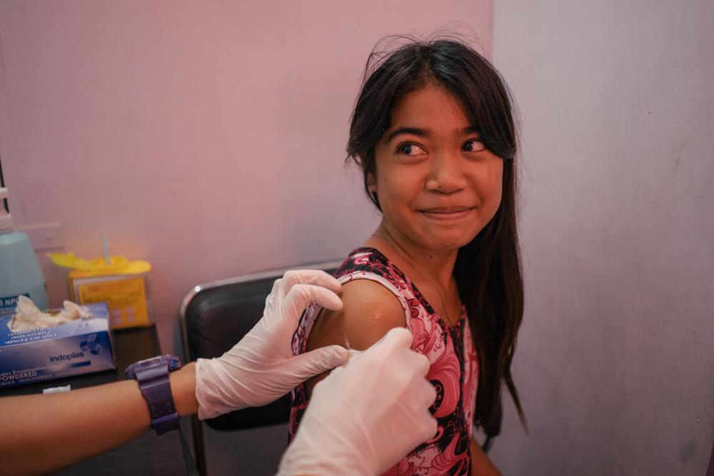 A young girl from Tondo, Manila, is seen in a Likhaan clinic for her free HPV vaccination. Likhaan provides reproductive healthcare services for low income families in the Philippines, where there remains a gap in women's awareness of their reproductive rights.Photo: Hannah Reyes Morales