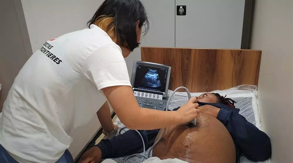 Marina the MSF Midwife on board the Ocean Viking performs an ultrasound on a 9 month pregnant woman. Hannah Wallace Bowman/MSF