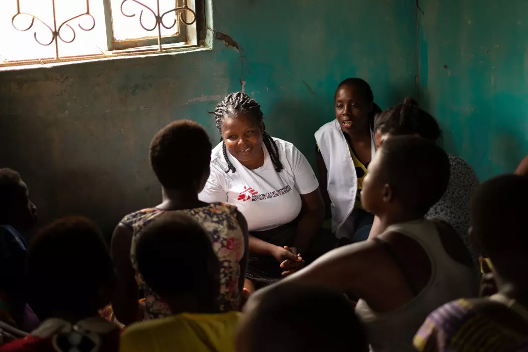 MSF health workers speak with a group of sex workers in Nsanje, Malawi, during a ‘one-stop’ outreach clinic in 2019. These clinics take place in different parts of the community on different days and provide a comprehensive package of sexual and reproductive health services and referrals. © Isabel Corthier/MSF