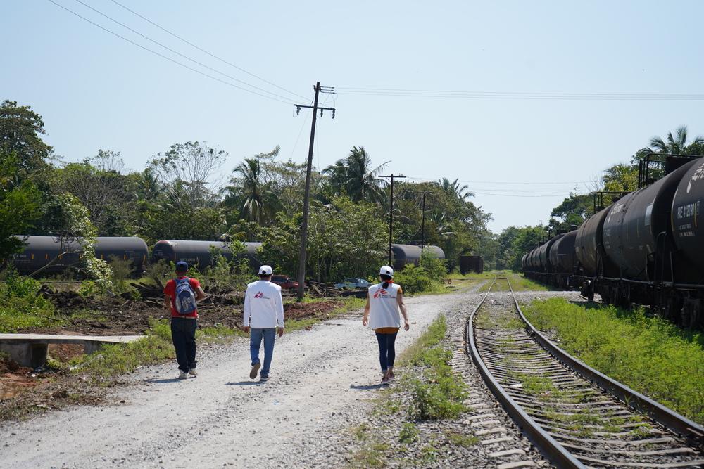 MSF staff walk on the train tracks at the Higueras station in Veracruz