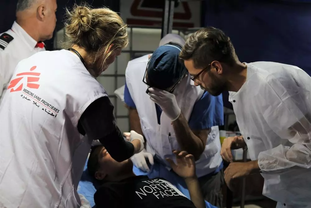 doctors treating patient