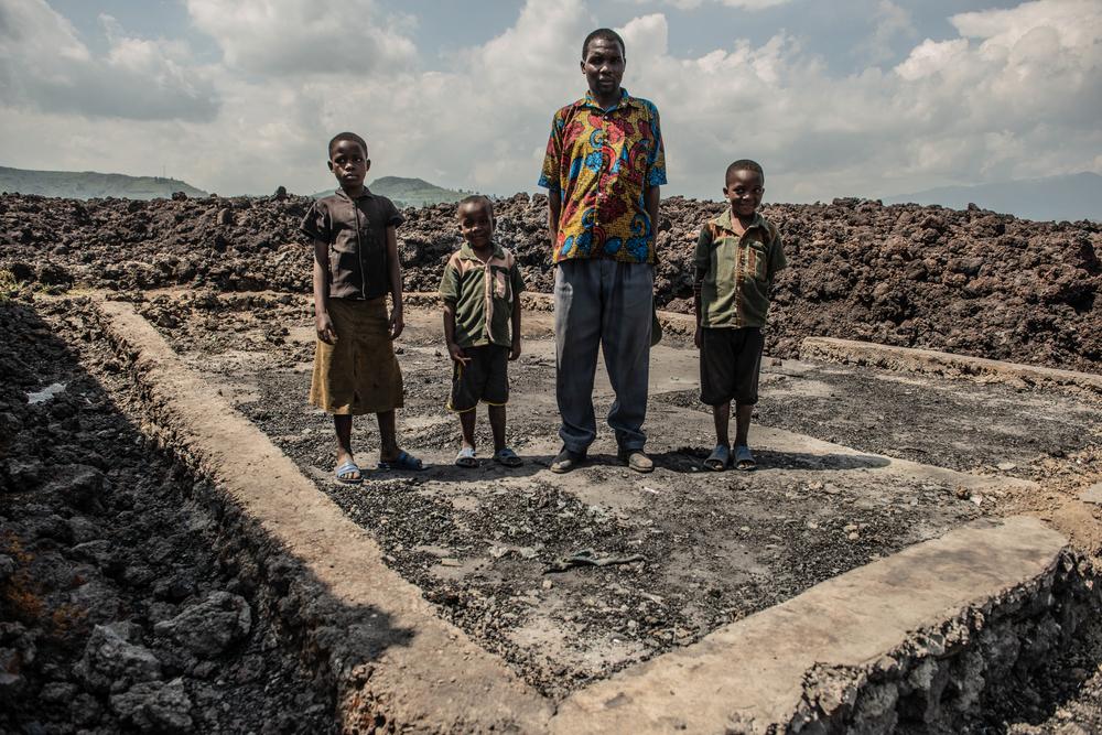 Dieudonné Bizimungu with his children next to their houe in Goma, DRC.