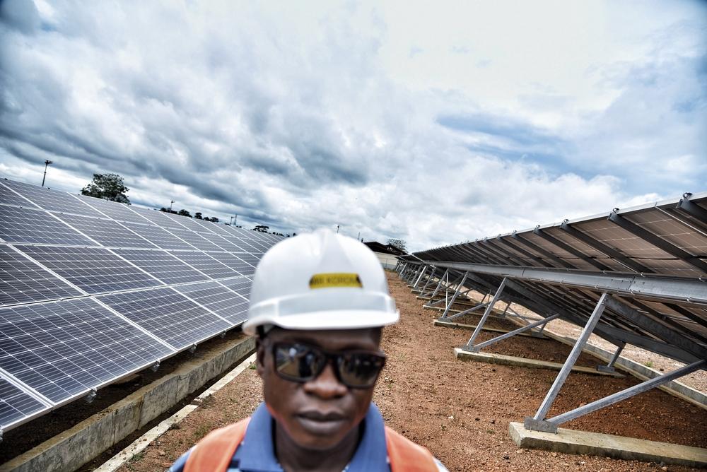 Logistics supervisor Mohammed Korma stands amid the solar panels that Doctors Without Borders has installed in Kenema district. Doctors Without Borders  is aiming to run the Hangha hospital fully with clean energy in the future.