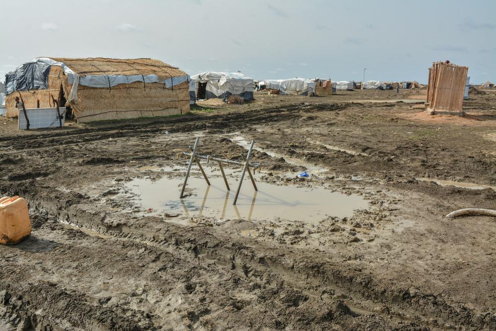 A tap stand sits in a pool of muddy water. Sudan 2021 © MSF/Dalila Mahdawi