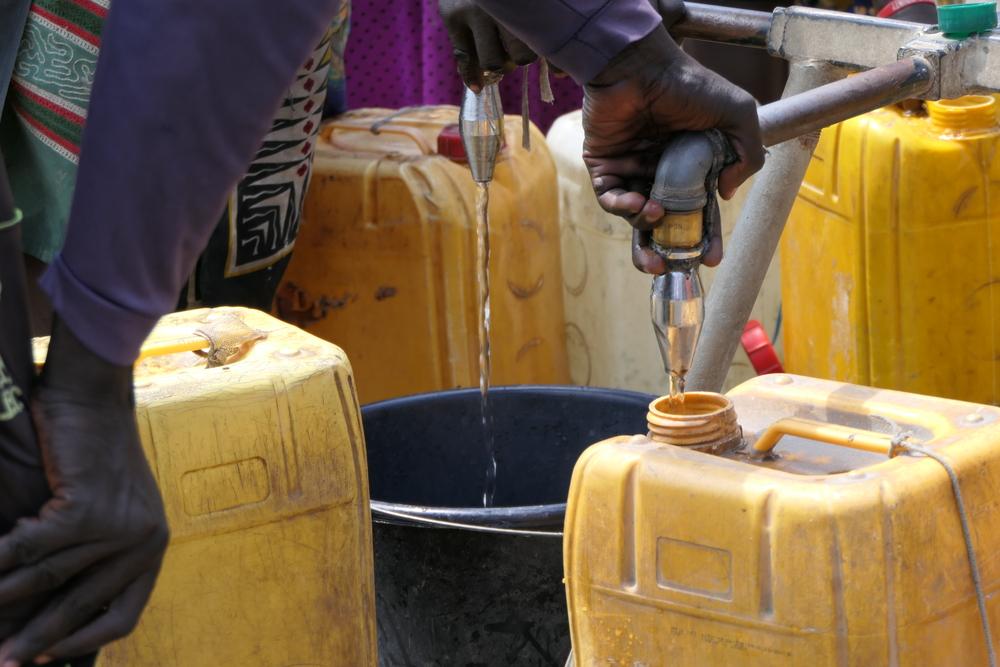 A water point in Bentiu IDP camp. Residents use water containers to collect, transport and store drinking water. Current structure is not enough to ensure a minimum of 15L of water per day to all individuals, as recommended in the international standard. 