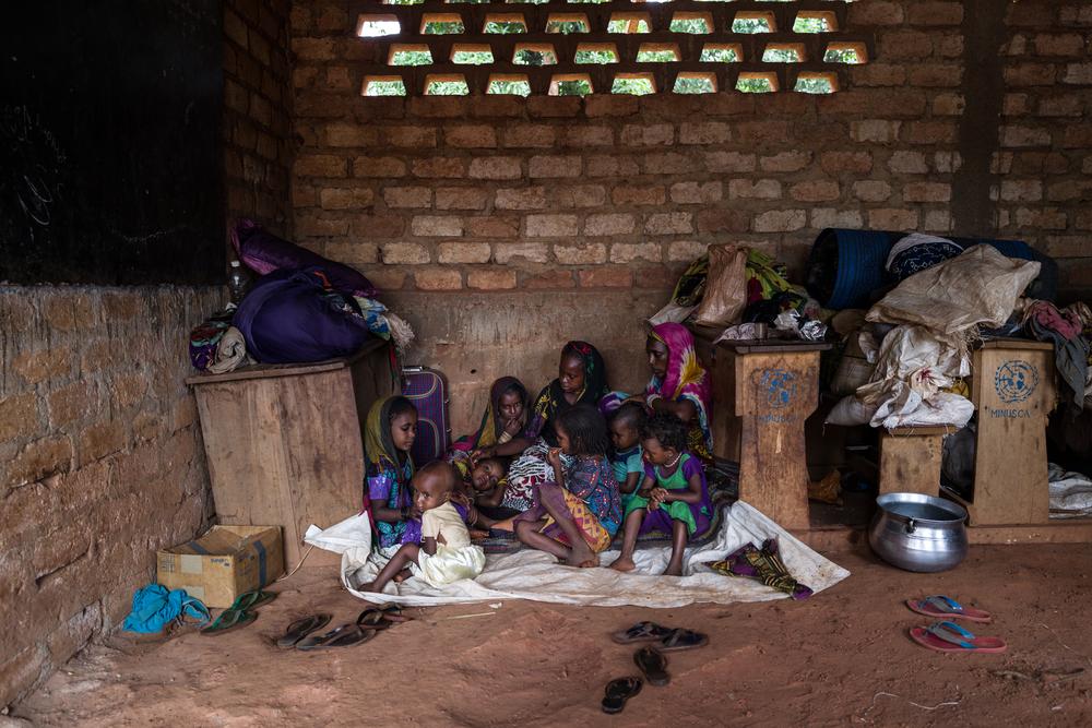 Hawa Oukarou, (40 yrs) has nine children. They sleep all together in a corner of the classroom inside the mosque. There are two other families with whom they share the space. Central African Republic, August 2021 © Lys Arango