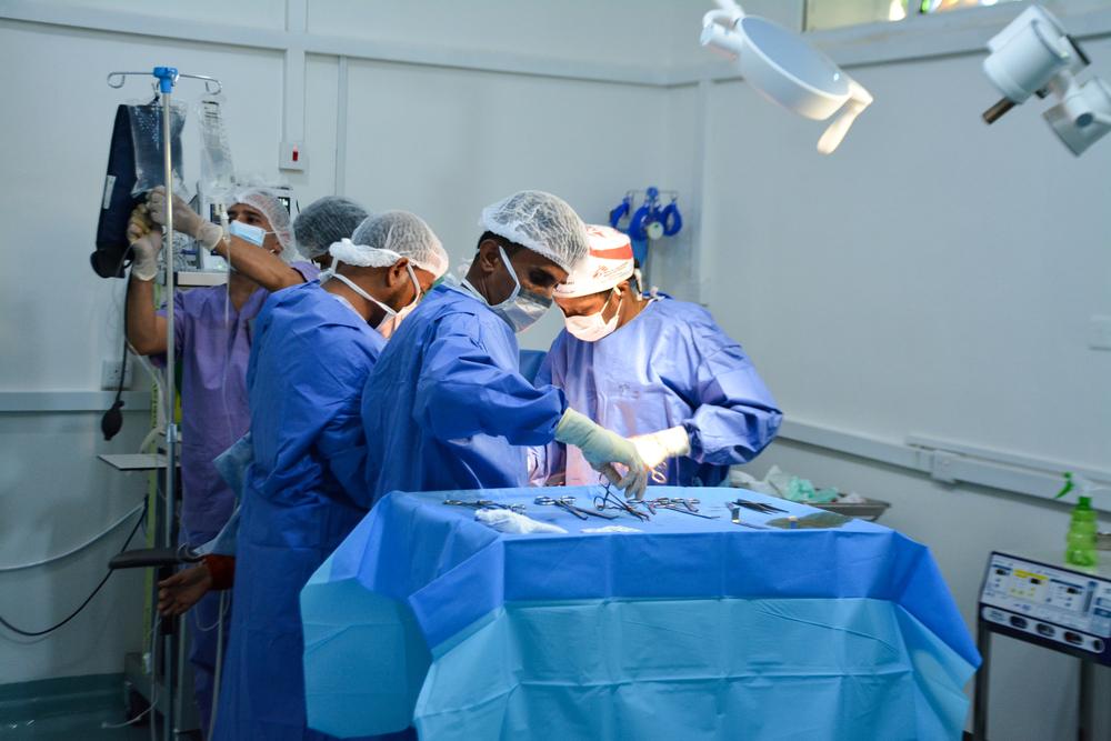 Surgery team conducting a cesarean section alongside the operating theatre team at the Al-Qanawis mother and child hospital in Hodeidah, Yemen. 