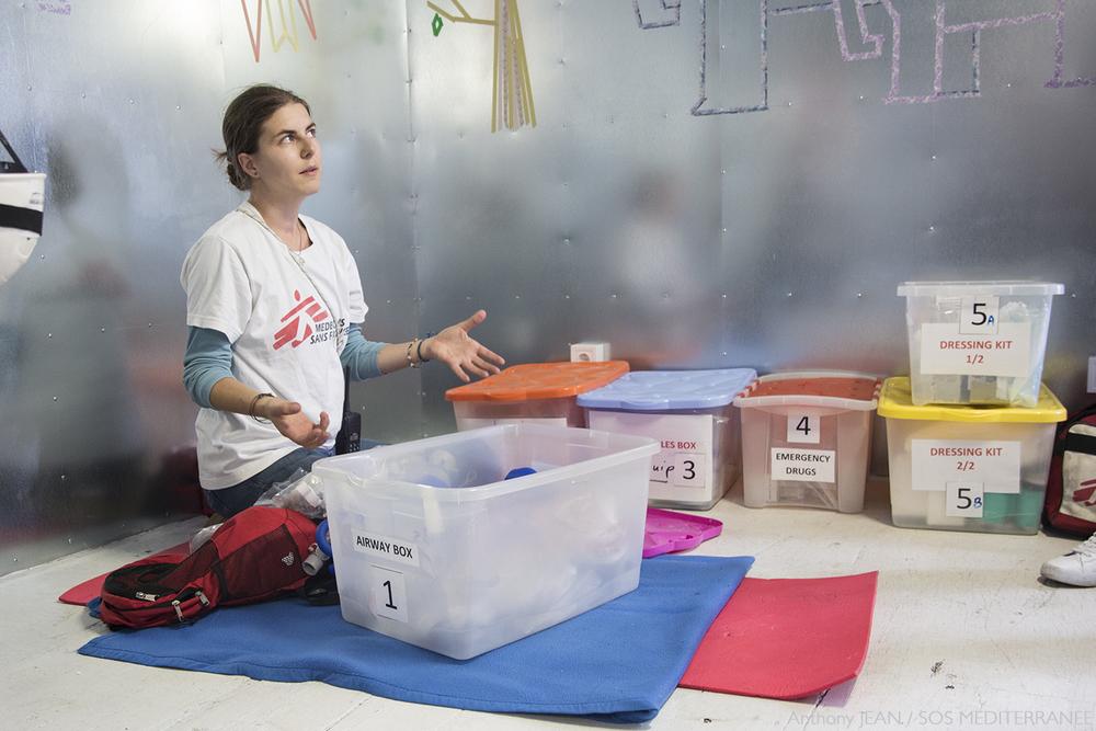 Stefanie Hofstetter, Medical Team Leader, sets up medical equipment in the shelter container of the Ocean Viking, as the team train for the event of a mass casualty at sea. 