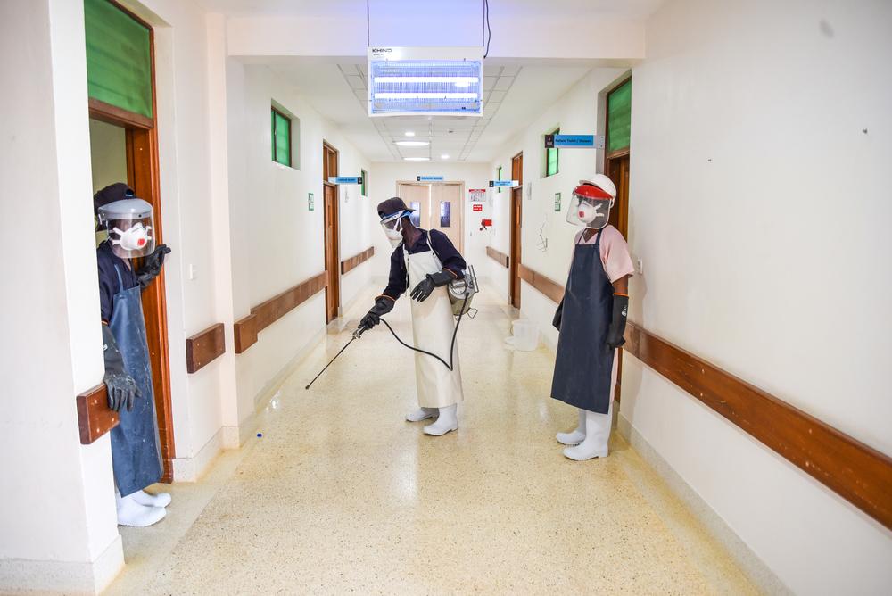 Doctors Without Borders' hygiene staff disinfecting the halls of Mrima Hospital in Likoni, Mombasa