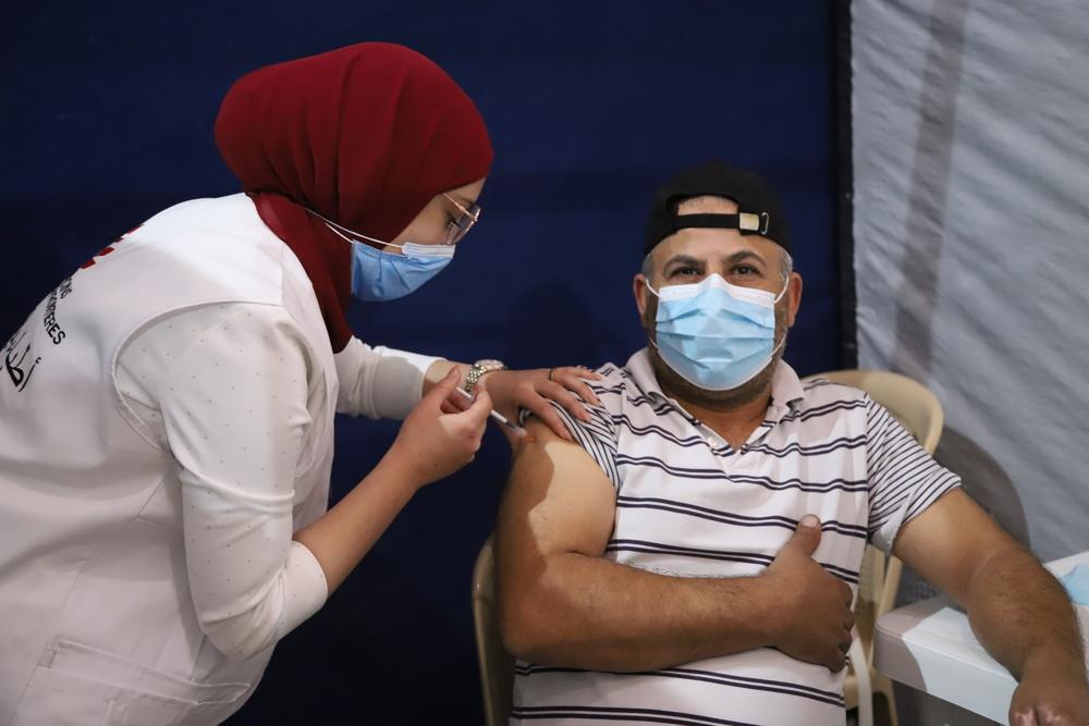 A man receives a dose of COVID-19 vaccine at the MSF vaccination center in Bar Elias (Bekaa Valley). Lebanon, 2021. 