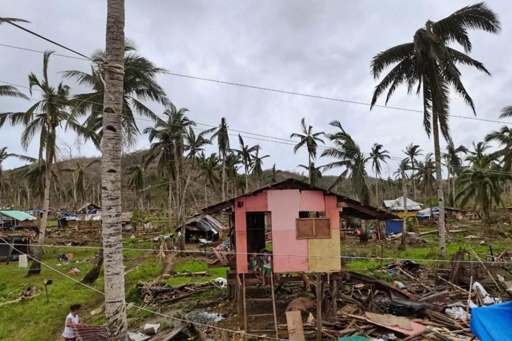In some parts of the island, residents chose to build makeshift houses with plastic sheets near their wrecked houses instead of staying at the evacuation center. typhoon rai