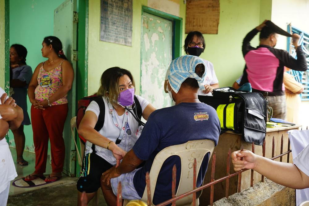 Dr. Chenery Ann Lim, Emergency Coordinator, checks on the sick and the elderly of Brgy. Cagutsan, Surigao City. Some complain of high blood pressure, while others report coughs and colds.