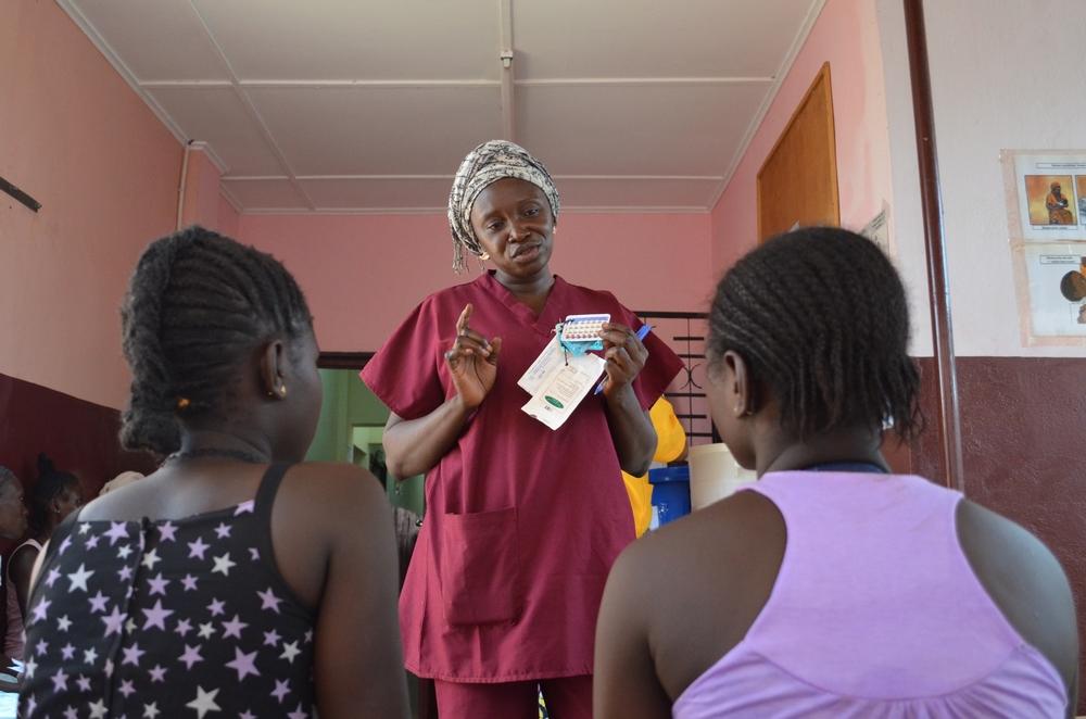 Health promoter explains the methods of contraception available to women and couples at the Gbaya Ndombia maternity clinic
