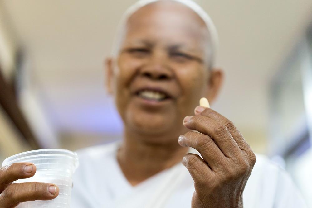 A Patient holds their meds at the MSF Hepatitis C clinic at Preah Kossamak Hospital in Phnom Penh.