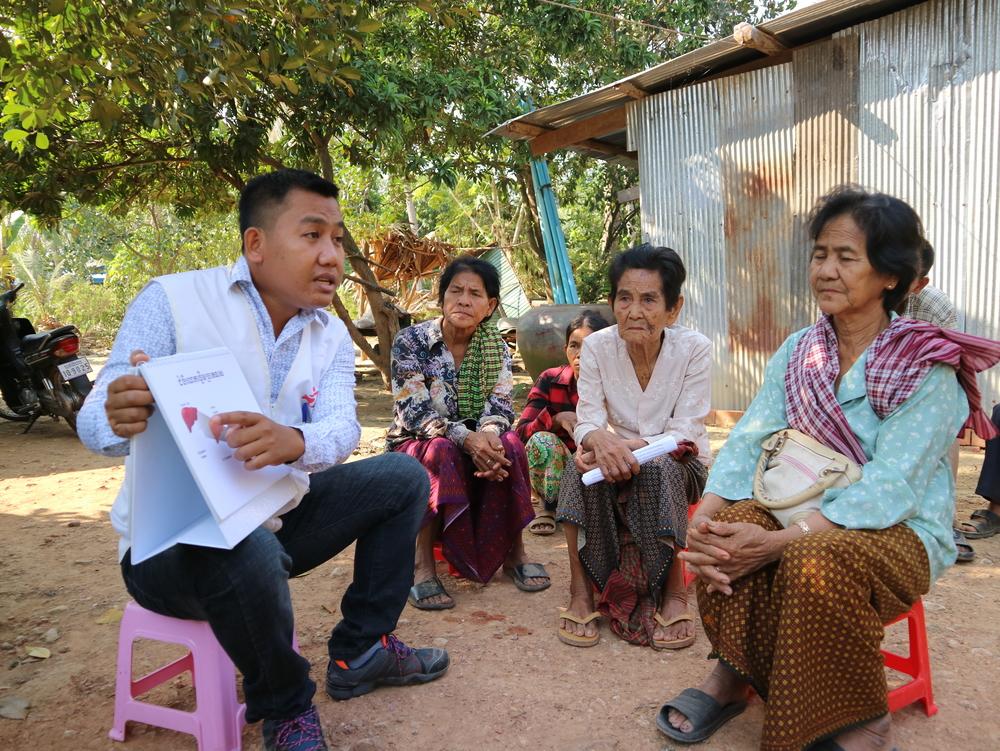 Khen Sophea carries out information and education activities during an active Hepatitis C case finding campaign in a village in Moung Ruessei district in Cambodia. 