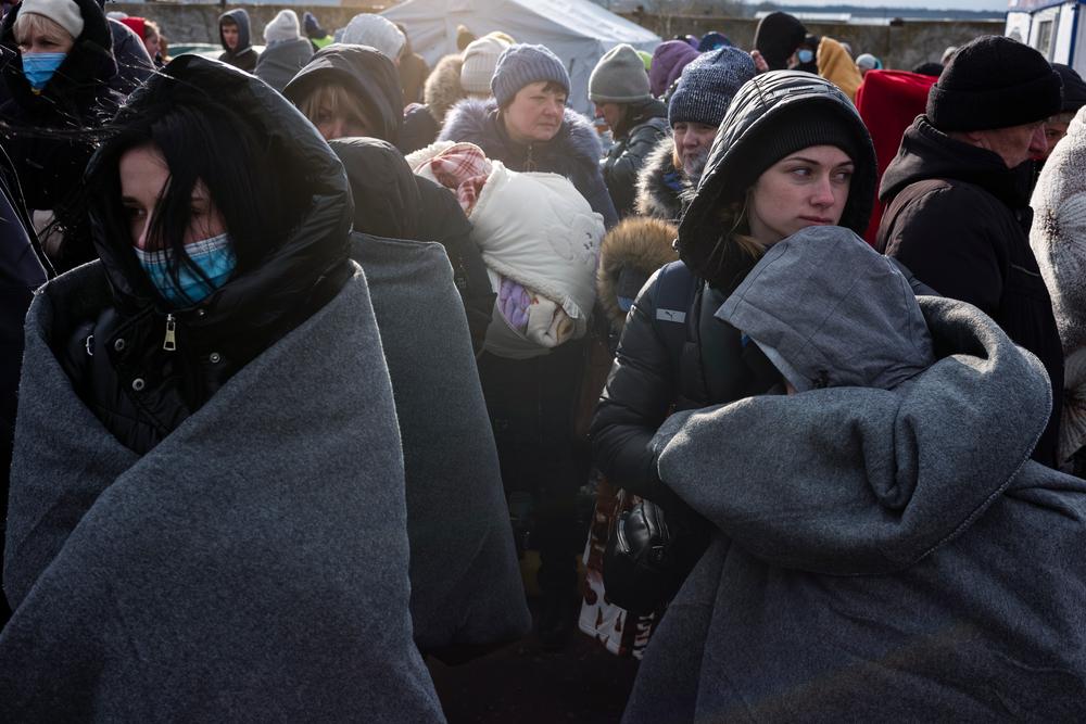 Ukrainian refugees awaiting to board buses at Palanca departure dispatch point.
