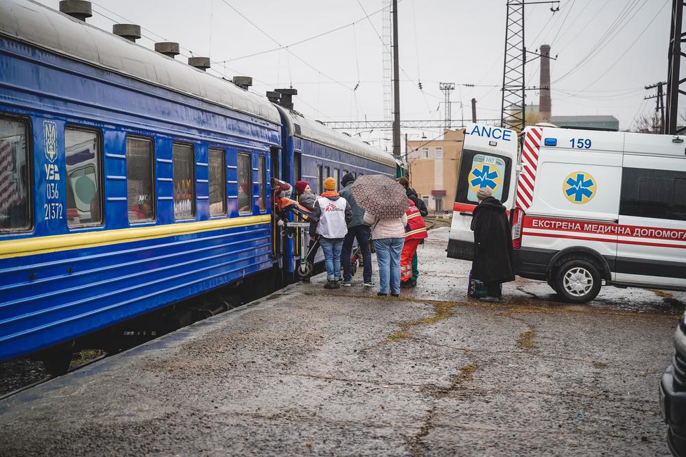 MSF staff unload the first patients from a medical referral train which arrived in Lviv on 1 April.