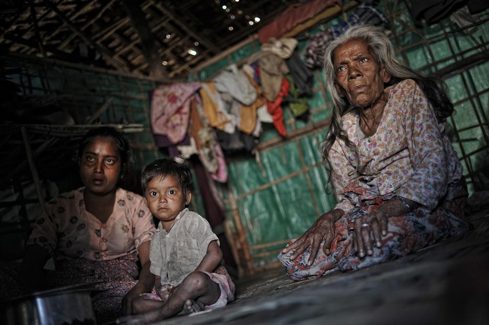 A family in their tent in a refugee camp on the outskirts of Sittwe, February 2, 2013