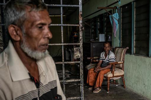 A Rohingya family in the dilapidated building where they live, in Puchong district near Kuala Lumpur.