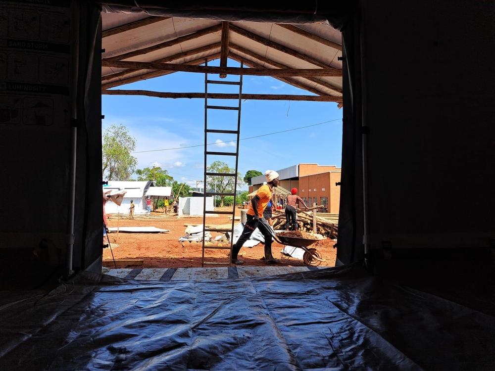 A labourer works on the construction of a 39-bed Ebola Treatment Centre in Mubende