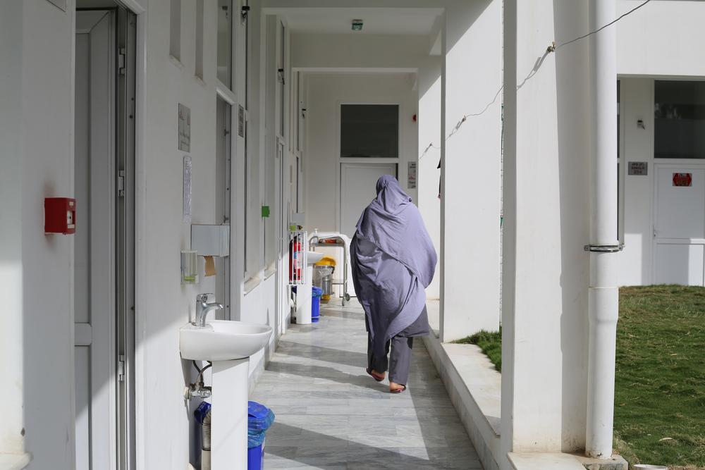 A nurse walks down the hallway of the women's inpatient ward at the MS drug-resistant tuberculosis (DR-TB) hospital in Kandahar city