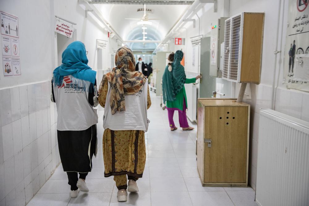 MSF staff walk down the corridor in the female inpatient department at the MSF-supported Boost hospital