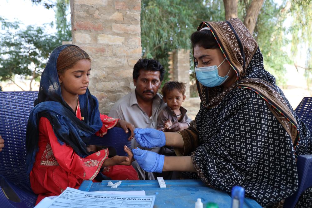 MSF staff nurse is conducting a rapid malaria test of his eldest daughter. Our mobile clinic teams have treated more than 9,500 patients in Eastern Balochistan.