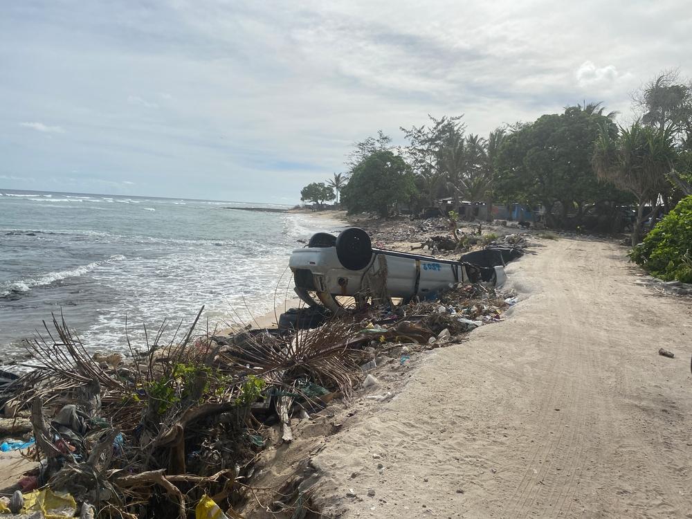 On a beach in a village in South Tarawa, the piles of rubbish littering the beach are everywhere. Locals have constructed barriers (built out of rubbish, tyres and sometimes cars) to protect the banks from sea surges and king tides. Kiribati, March 2023. © MSF/Nicolette Jackson