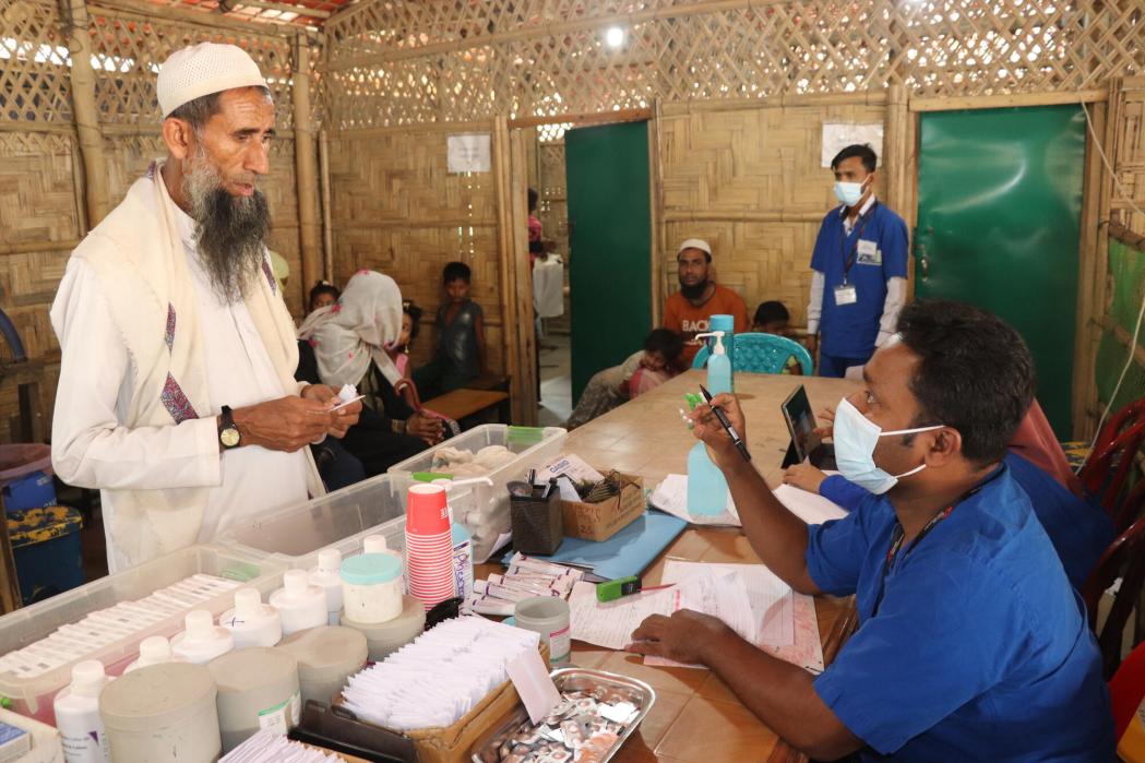 MSF medical staff provide medicines to Soyed Ullah, who suffers from for scabies, after a large outbreak of the skin infestation in Cox's Bazar. Bangladesh, 14 March 2023. 