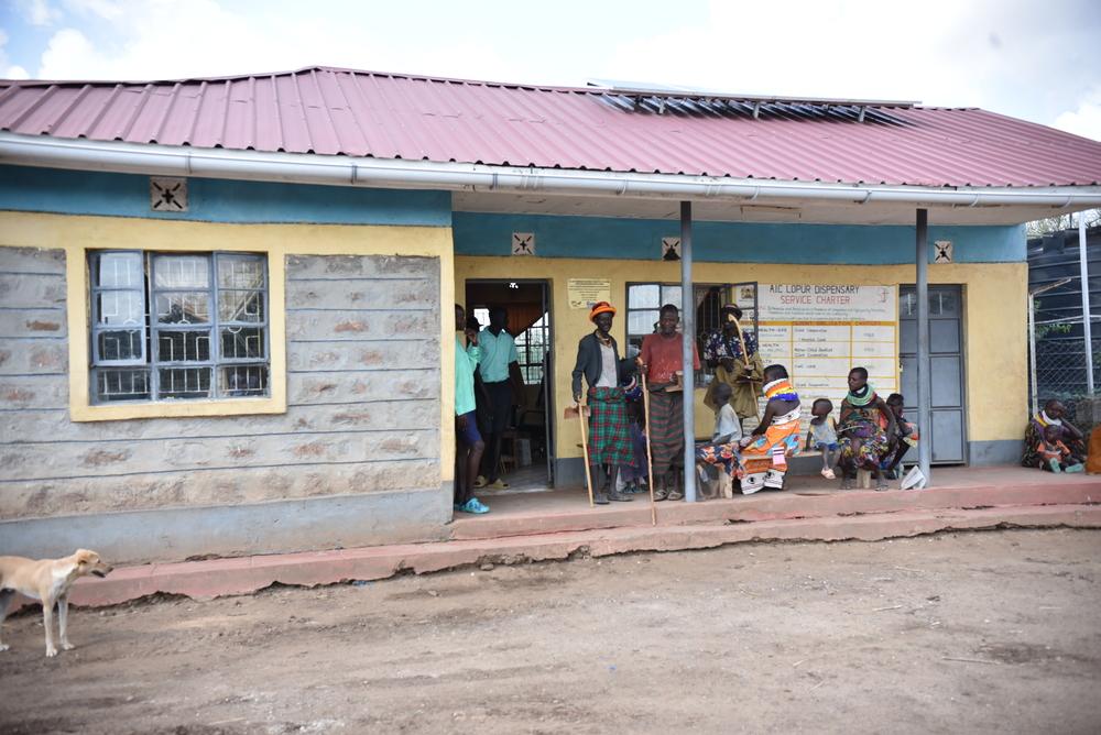 Patients wait for medical consultations outside the Lopur dispensary. Doctors Without Borders is also supporting the Turkana County Ministry of Health in strengthening measles and malaria case management in two primary health facilities in Lopur, one of the wards reporting the highest cases of measles and malaria. Kenya, July 2023. © MSF/Lucy Makori
