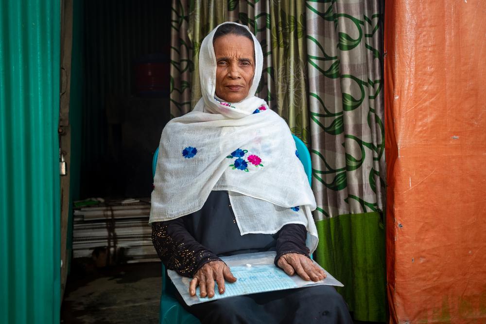 Melua, 65, made the tough decision to leave her home in Myanmar due to increasing violence. Looking back on the hurried departure, she says, "In the urgency of it all, I grabbed a few essential documents and our family portraits: my daughter's birth certificate and a family photo. I even left behind clothes that I had freshly washed."