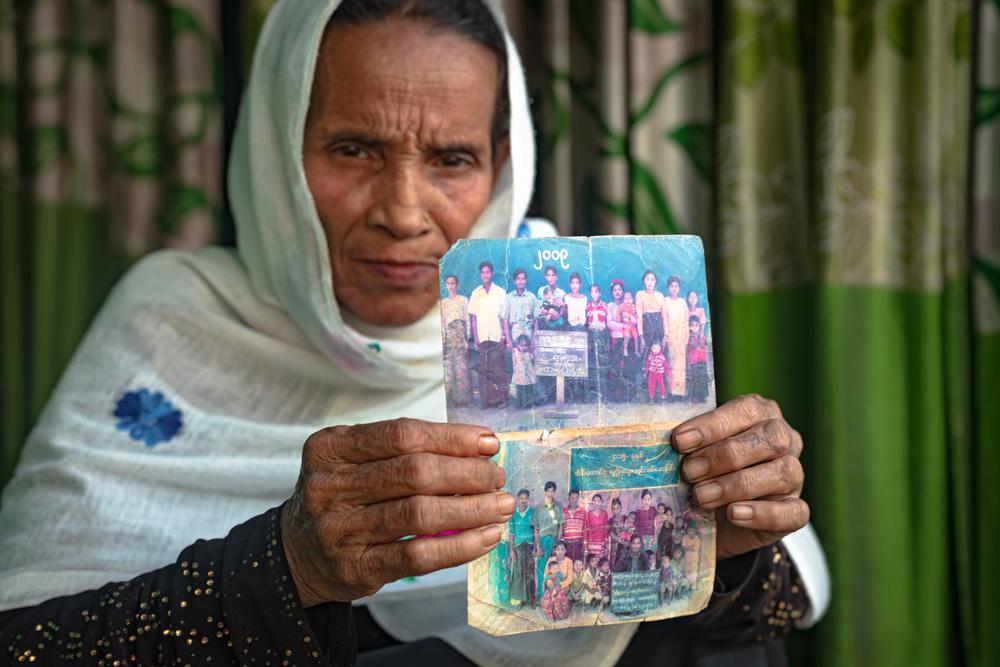 Melua, 65, holds dear the few belongings she was able to bring with her when she fled her home in Myanmar. Among them are these precious photographs of her family. 