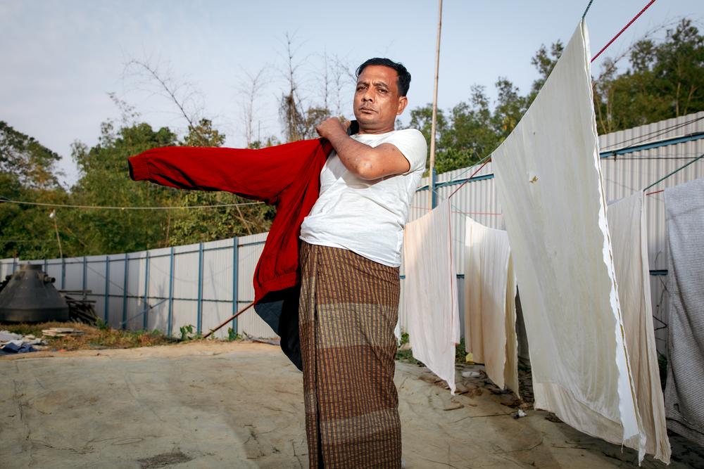Habibullah, 52, wears the only jacket he took with him during his journey from Myanmar to Bangladesh. 
