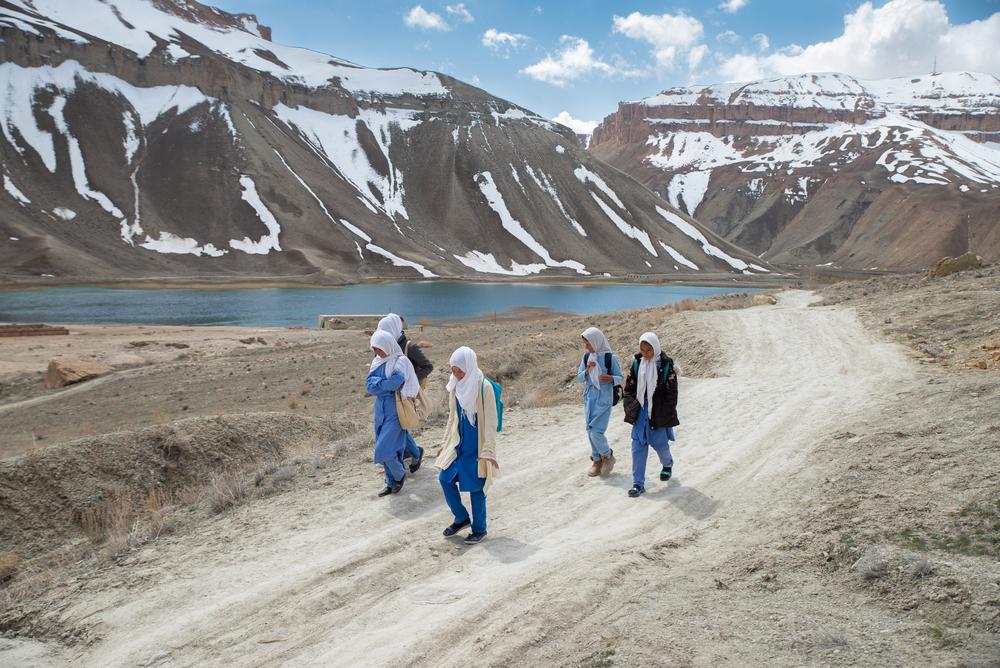 Girls walk to school in Band-e-Amir, a remote district in Bamyan province, where MSF opened a community health facility in the town; there is no other health facility for women and children in the area. Bamyan province, Afghanistan, April 2023. © Nava Jamshidi