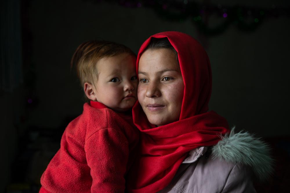 A mother with her baby girl at her home in Jarokashan, a village in Band-e-Amir. MSF provides healthcare in a community where there are no other options for women and children. Bamyan province, Afghanistan, April 2023. © Nava Jamshidi