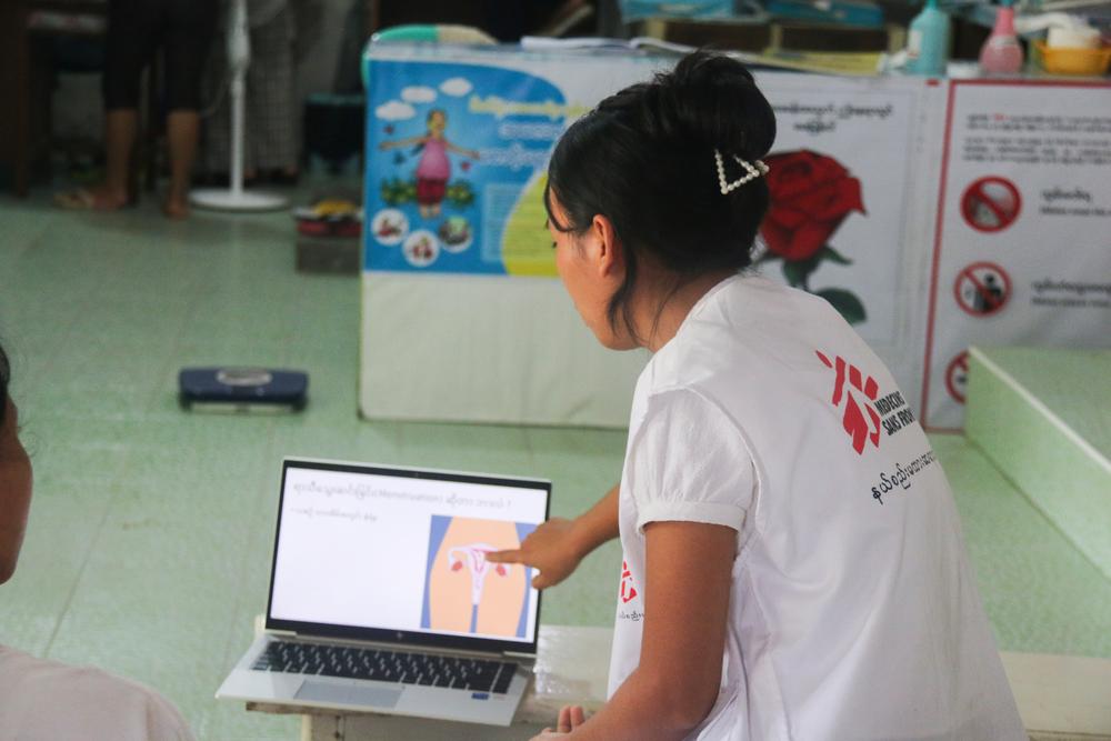 Doctors Without Borders Health Promotion Supervisor delivers sexual and reproductive health education lessons to patients at a new sexual reproductive healthcare clinic in the Bhamo area of Kachin state. Myanmar, August 2023. © Zar Pann Phyu/MSF