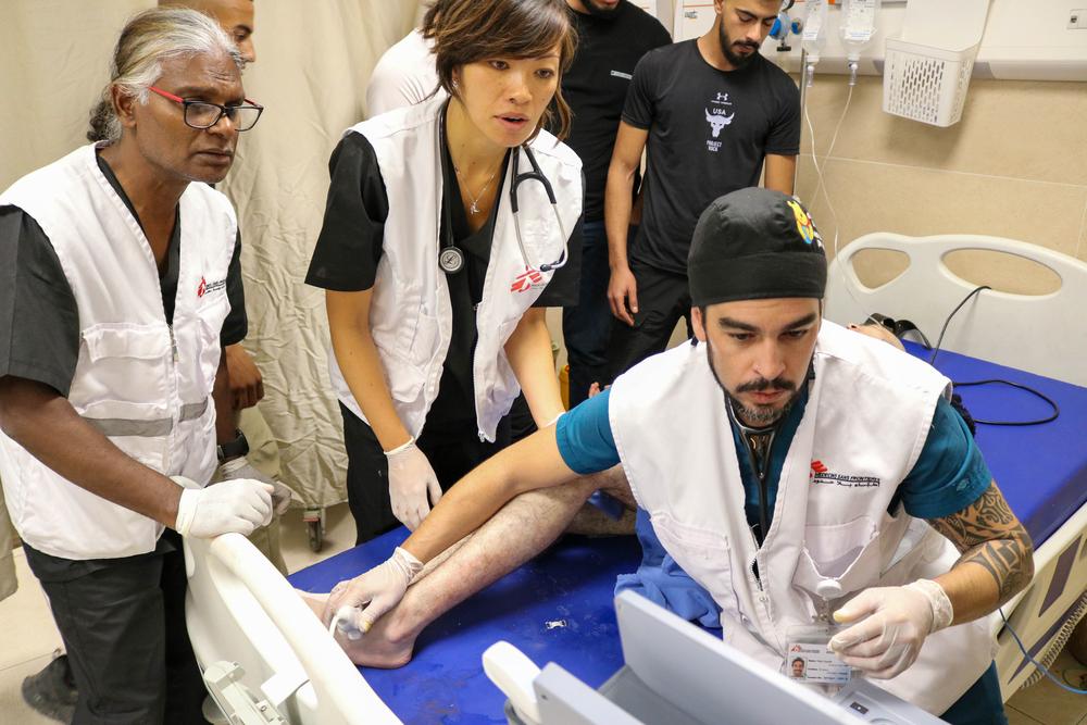 MSF medical staff treat wounded people at 2am in Jenin hospital, following an Israeli forces incursion on Jenin refugee camp. Jenin, West Bank, Palestine, 27 October 2023. © Faris Al-Jawad/MSF