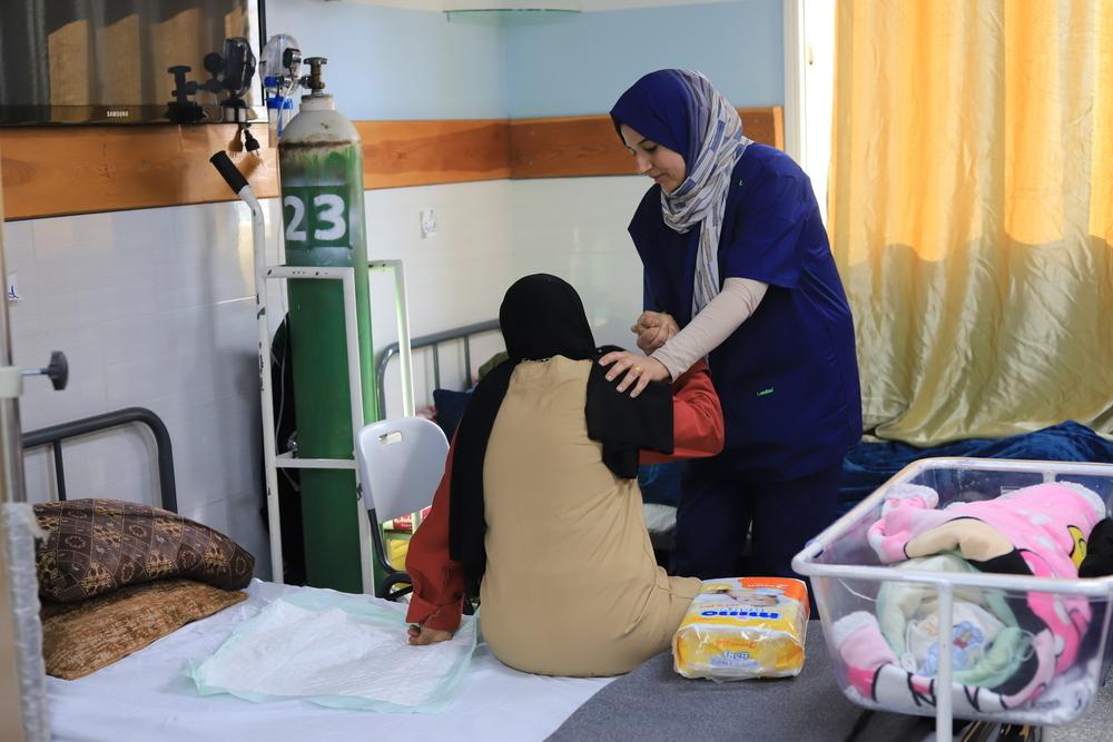 MSF nurse is assisting patient in the Emirati maternity hospital, Rafah. Palestinian Territories, January 2024. © Mariam Abu Dagga/MSF 