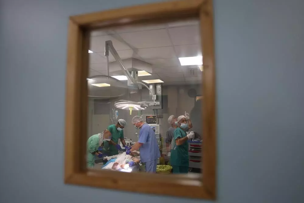 Surgical team working in operating room at Nasser hospital, Khan Younis. 