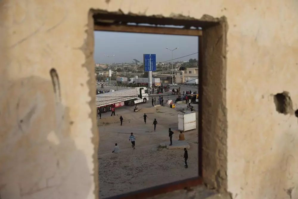 The number of trucks entering Gaza