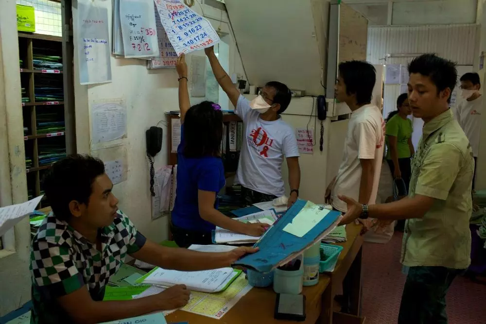 Doctors Without Borders staff manages the daily routines, registers patients coming in for consultation, and files the folders corresponding to the various patients. Myanmar, February 2012. © Matthieu Zellweger