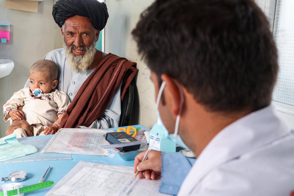 A father brought his malnourished grandson to the MSF Ambulatory Therapeutic Feeding Centre (ATFC)in Kandahar.