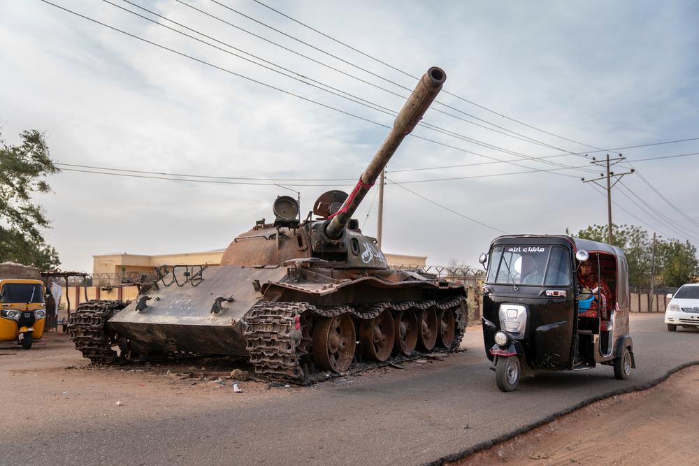 Sudan: Doctors Without Borders report reveals catastrophic toll of ‘a war on people’. A rickshaw taxi goes around a destroyed tank belonging to the Sudanese Armed Forces, a remnant of the violent clashes that took place in El Geneina, West Darfur, in 2023. Sudan, February 2024. © Diana Zeyneb Alhindawi