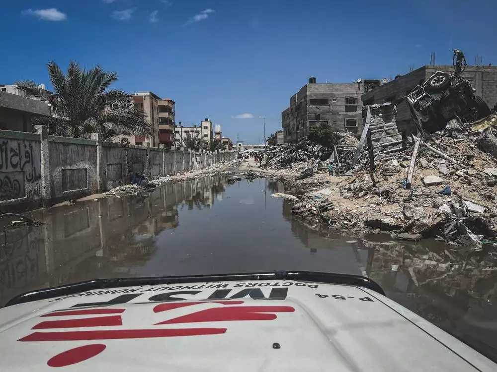 The streets around Nasser Hospital are flooded with sewage. 
