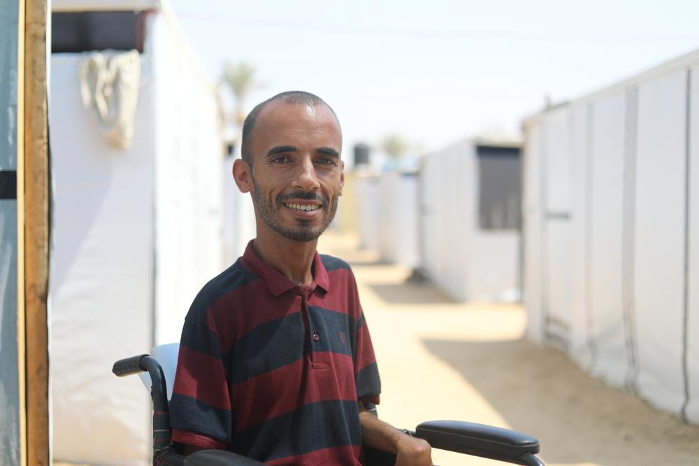 A Palestinian man sitting on a wheelchair. Displaced people face sanitation crisis in Khan Younis, including for people with disabilities.